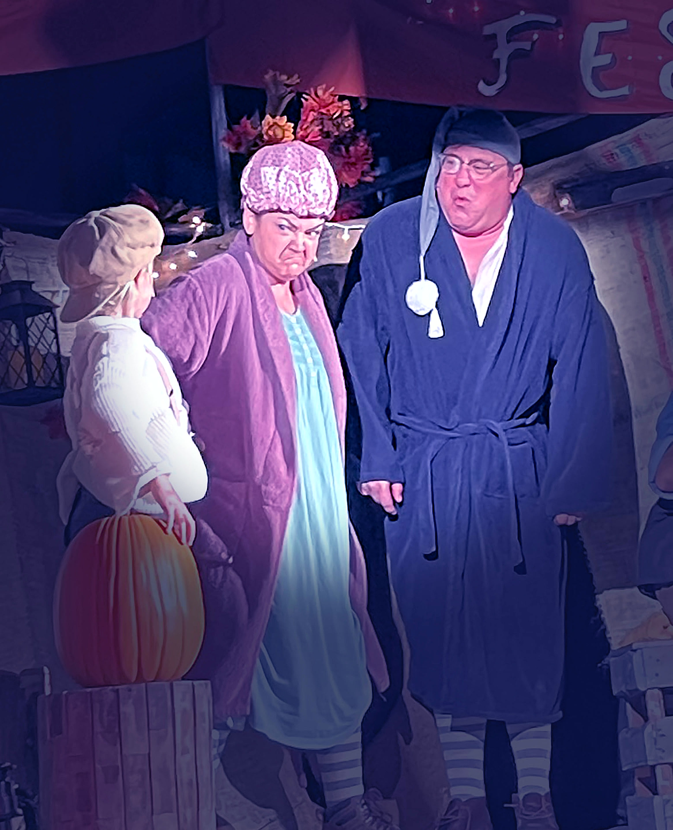 The Candle People: Jane Curry, Karey Montoya-James and Bryan Plummer gathered around the Pumpkin Kid during a tense village scene